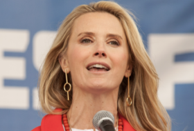 jennifer siebel newsom speaking into a microphone at an event