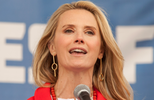 jennifer siebel newsom speaking into a microphone at an event