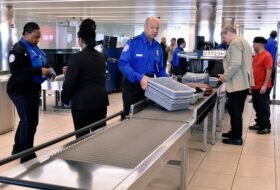 TSA agents engaging with passengers at airport security