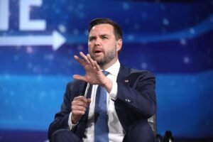 JD Vance speaking into a microphone at an event