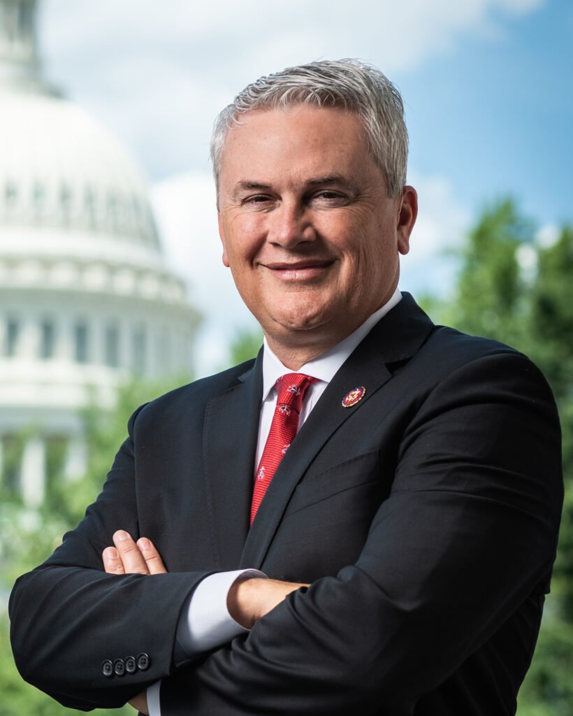 Rep James Comer smiling with his arms folded